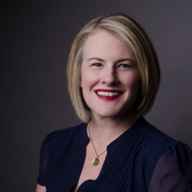 Kate Winget, Chief Revenue Officer at Morgan Stanley at Work seen with a bright smile on her face